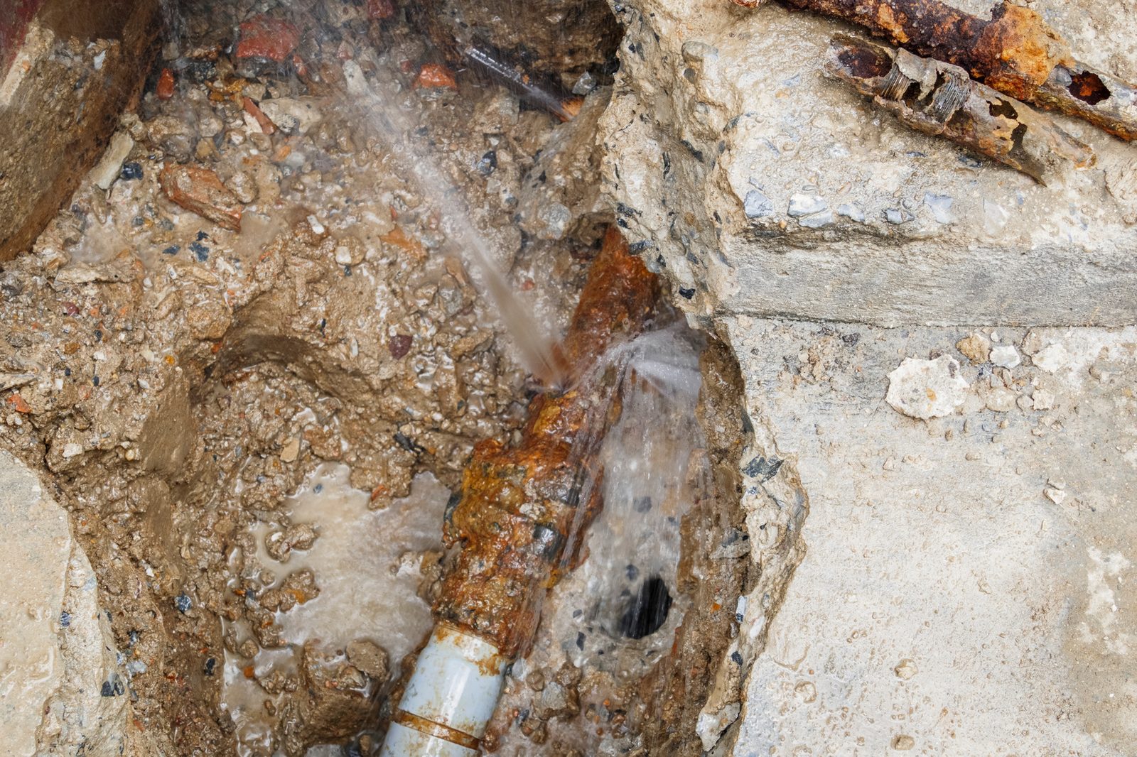 Corroded galvanized water pipe with rust and decay
